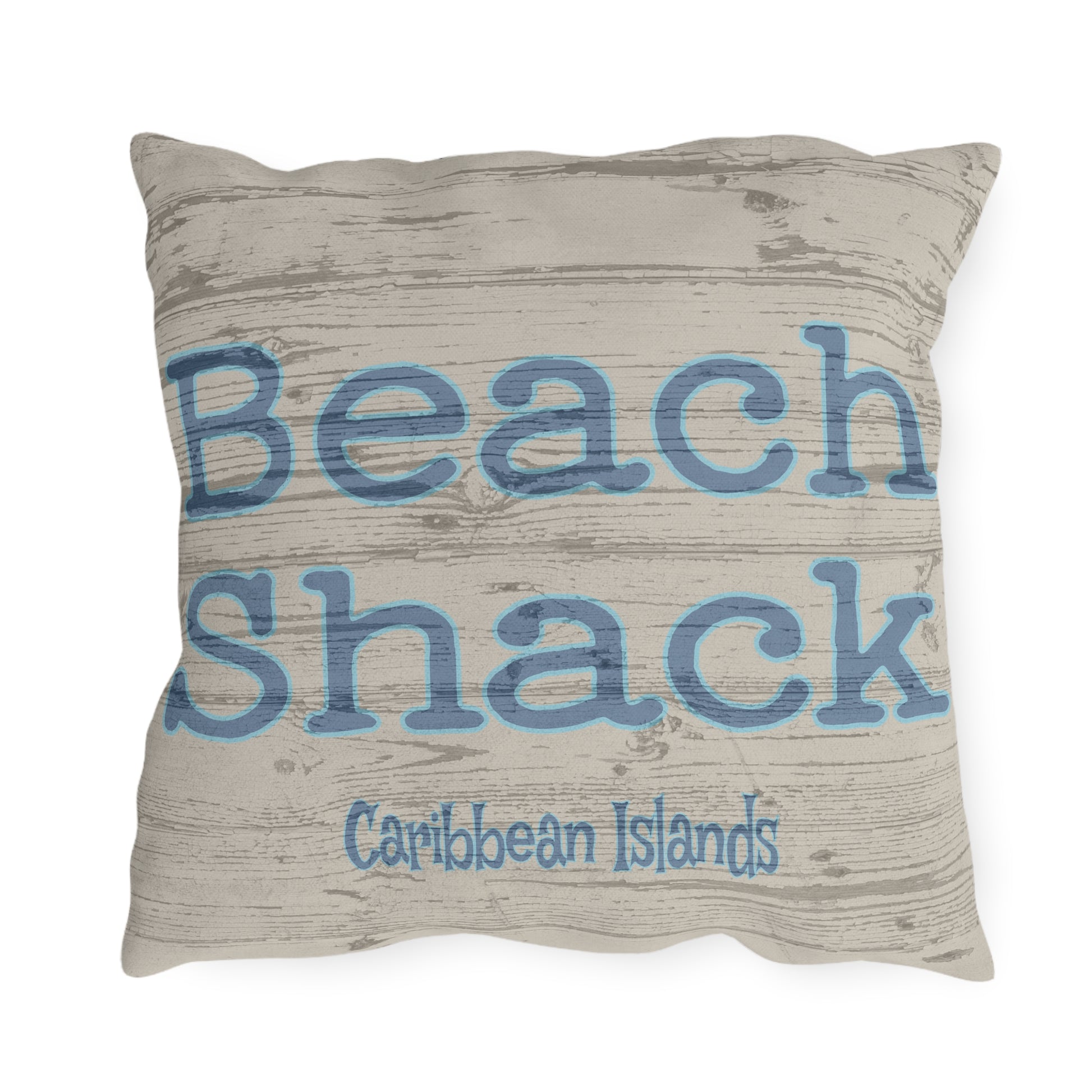 Pillow with 'Beach Shack Caribbean Islands' text on a textured background