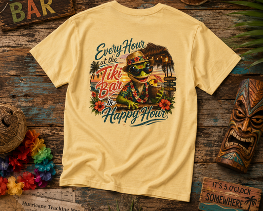 Beige t-shirt with a tropical design featuring a frog and text on a wooden surface with tiki bar decor.