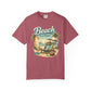 Maroon t-shirt with 'Beach therapy' graphic design on a white background
