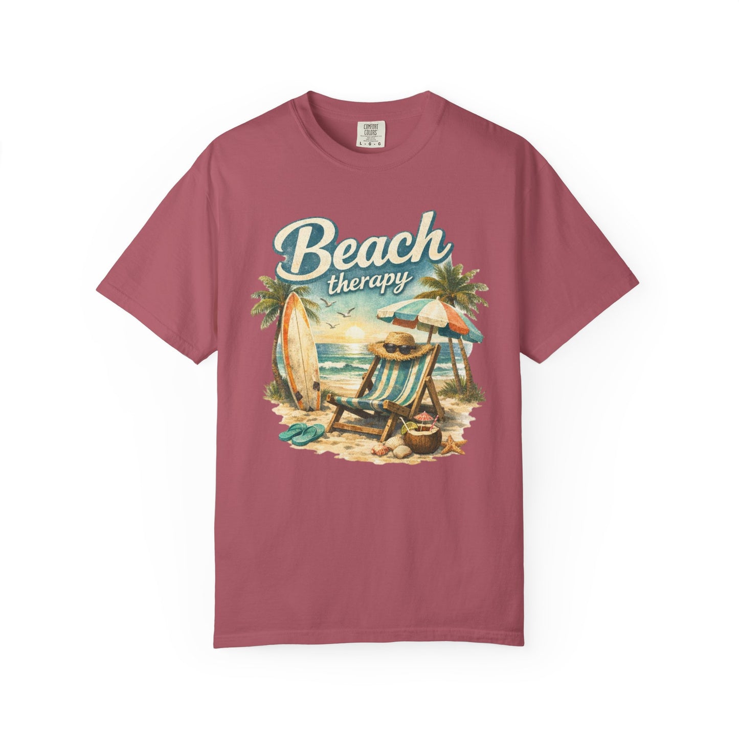 Maroon t-shirt with 'Beach therapy' graphic design on a white background