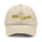 Beige cap with 'BIG CATCH' text and fish graphic on a white background