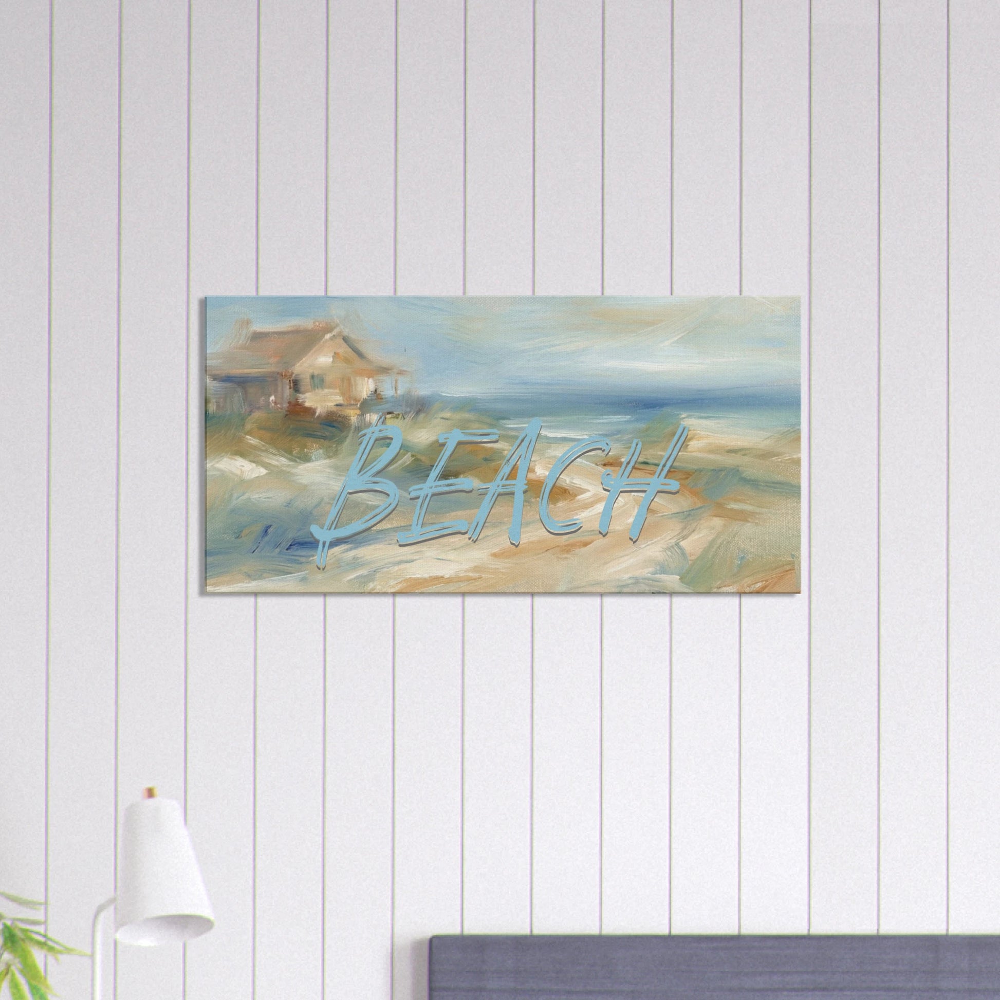 Painting of a beach scene with 'BEACH' text on a white paneled wall.