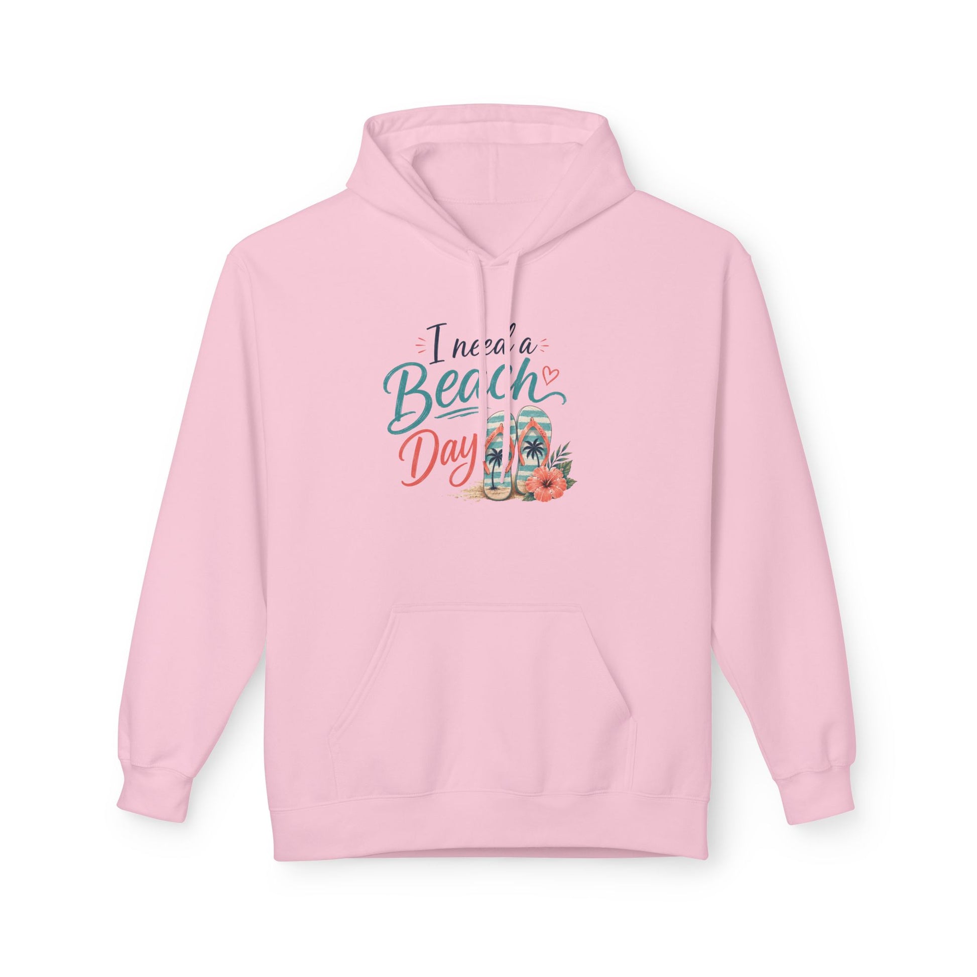 A light pink pullover hoodie with a graphic on the chest that reads 'I need a Beach Day' in teal and coral script, accompanied by illustrations of a beach umbrella, palm tree, and flowers. The hoodie is displayed against a clean white background.