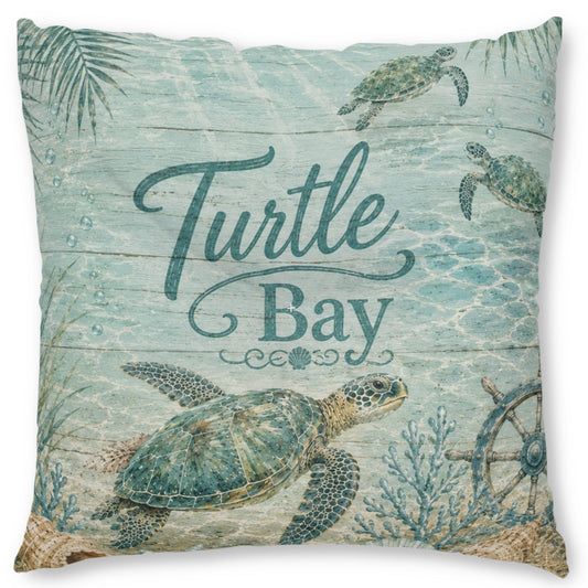Square decorative throw pillow featuring a sea turtle underwater scene with the words 'Turtle Bay' in teal script, on a light aqua wood-plank style background.