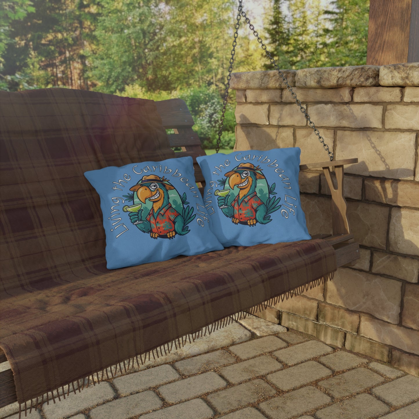 Two blue pillows with a cartoon character on a wooden swing set against a stone wall and greenery.
