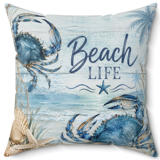 A square decorative throw pillow featuring a blue and beige 'Beach Life' nautical print with crabs and palm leaves on a white background.