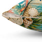 Square pillow with zipper opening and seashells; teal water, beige sand, and leaf pattern