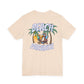 Beige t-shirt with 'Beach Paradise' graphic featuring a palm tree and lounge chair on a white background by Caribbean Rays