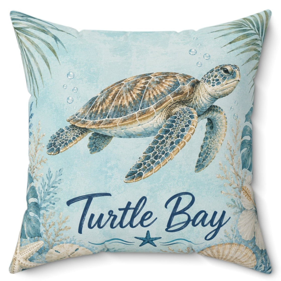 A square decorative throw pillow featuring an illustration of a sea turtle on a light blue background with palm leaves, seashells, and the words 'Turtle Bay' in navy script.