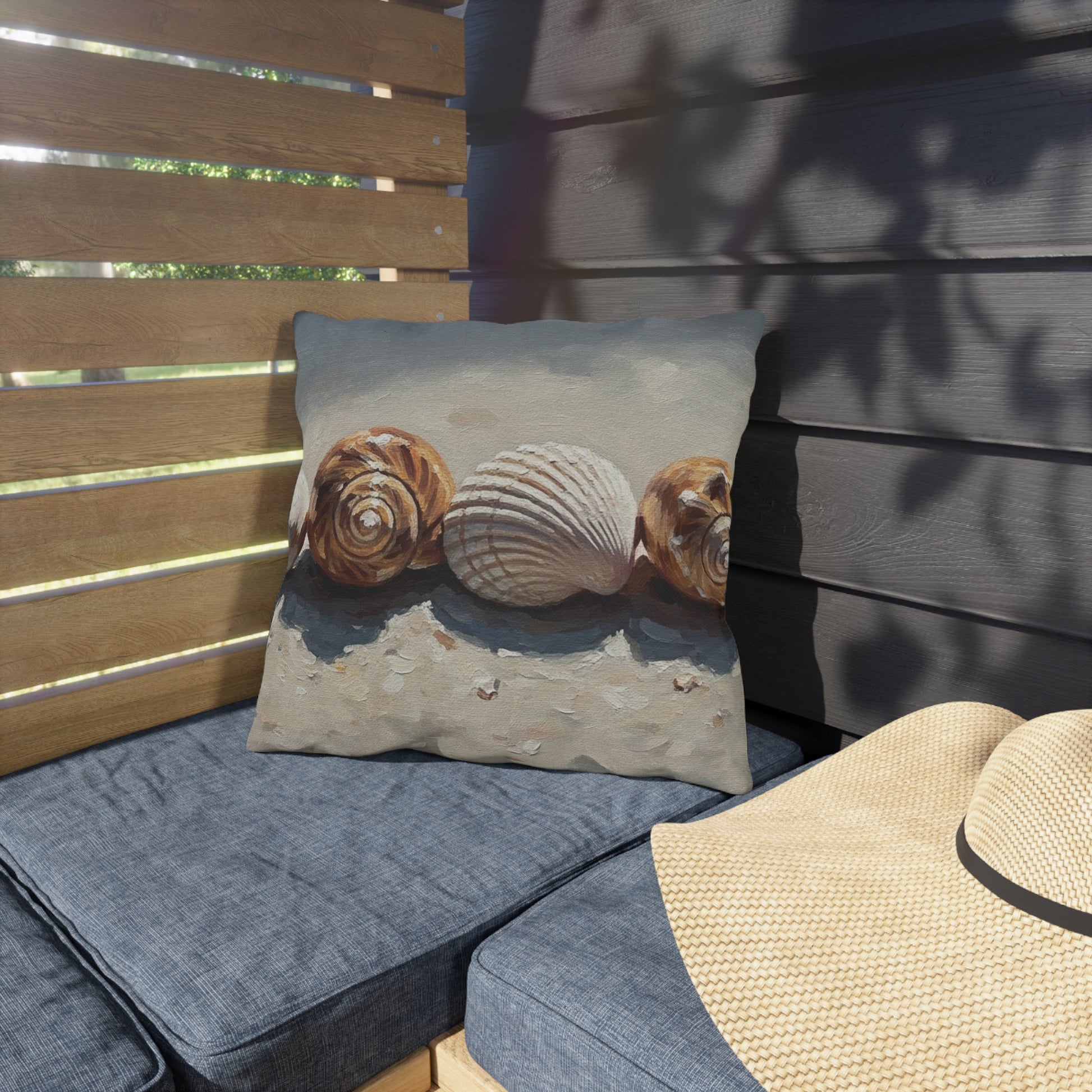 Decorative pillow with shell design on a wooden bench