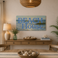 Dining room with 'Beach House' sign above a wooden table.