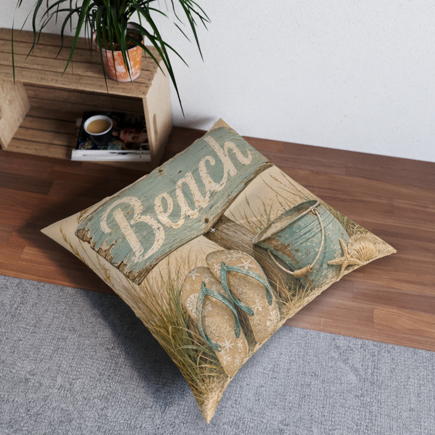 Square beach-themed floor pillow, beige cover with teal “Beach” banner and sandals artwork