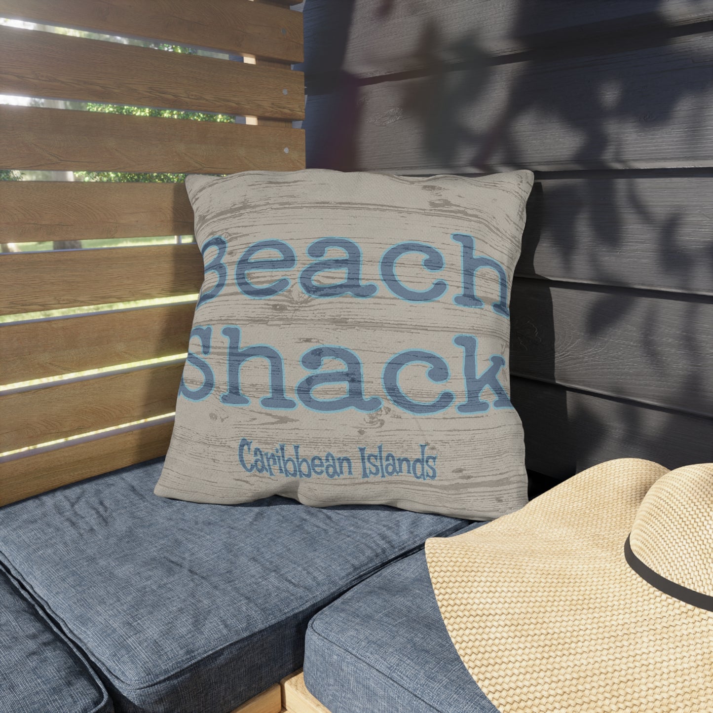 Pillow with 'Beach Shack Caribbean Islands' text on a wooden bench