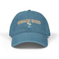 Blue baseball cap with a dog face design on a white background
