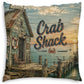 A square throw pillow featuring a vintage-style printed illustration of a crab shack by the ocean, with large 'Crab Shack' lettering on the front.
