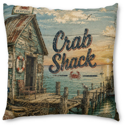 Square throw pillow featuring a rustic nautical print with a weathered shack, wooden dock, ocean, and the words 'Crab Shack' in large lettering.