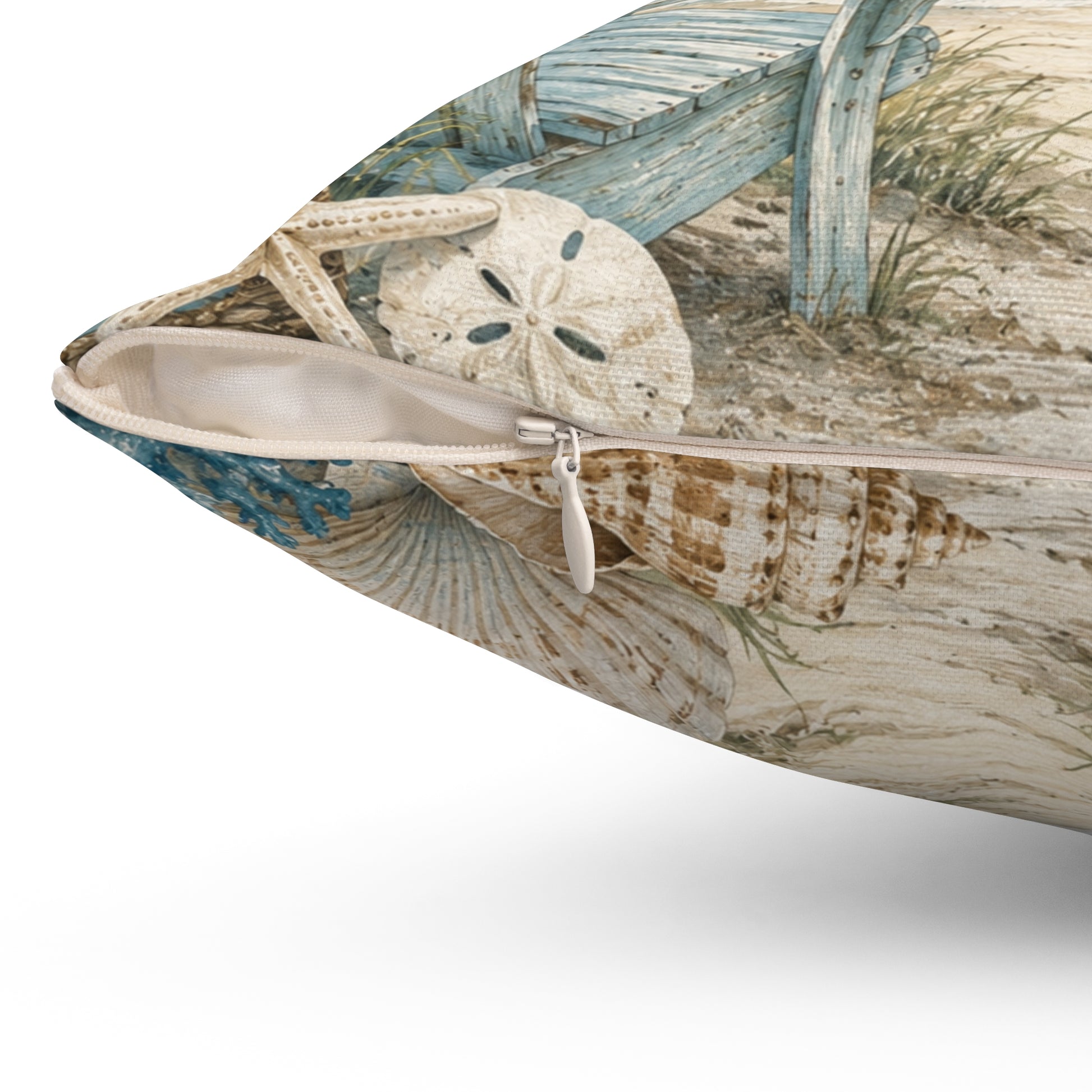 Side view of square polyester throw pillow with zipper, seashell and ocean beach design.