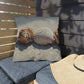 Decorative pillow with shell design on a wooden bench