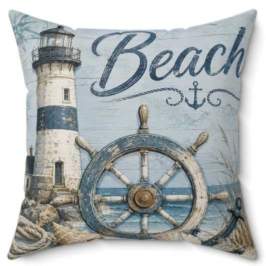 A square decorative throw pillow featuring a nautical design with a lighthouse, ship's wheel, rope, anchor, and the word 'Beach' on a light blue distressed background.