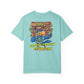 Light blue t-shirt with a colorful graphic of a parrot and tiki bar on the back, on a white background.