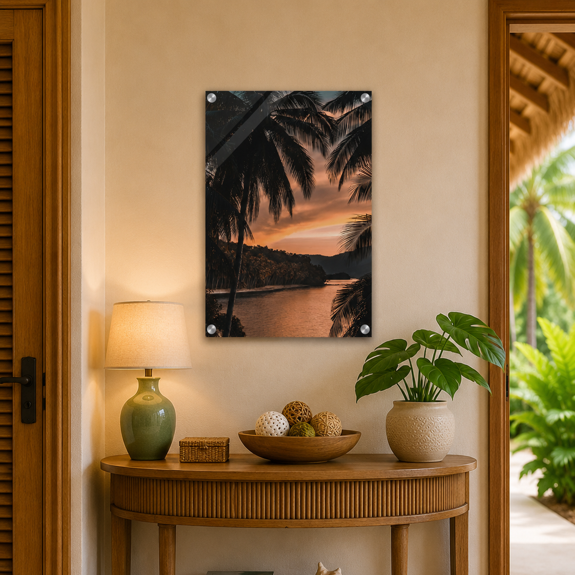 Decorative wall art of a sunset over water with palm trees in a home setting.