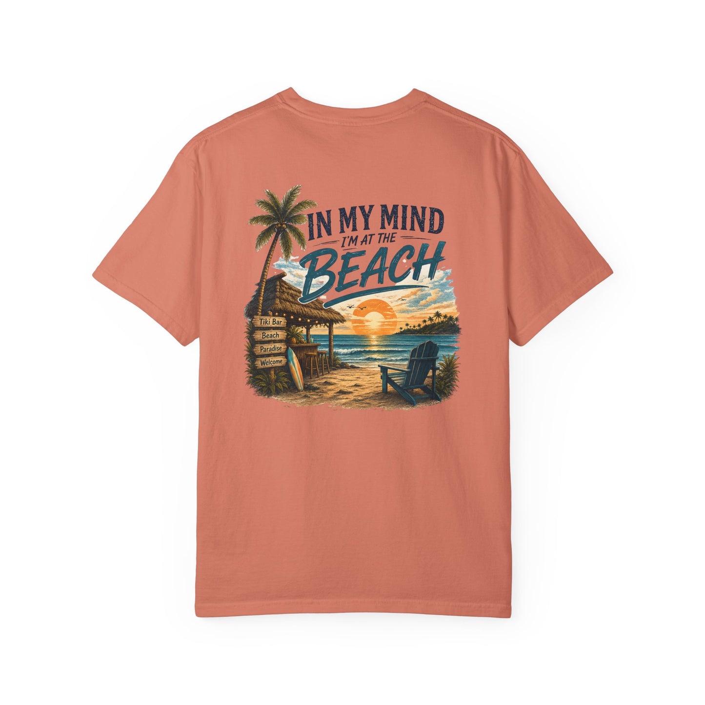 Peach-colored t-shirt with beach graphic and text on a white background