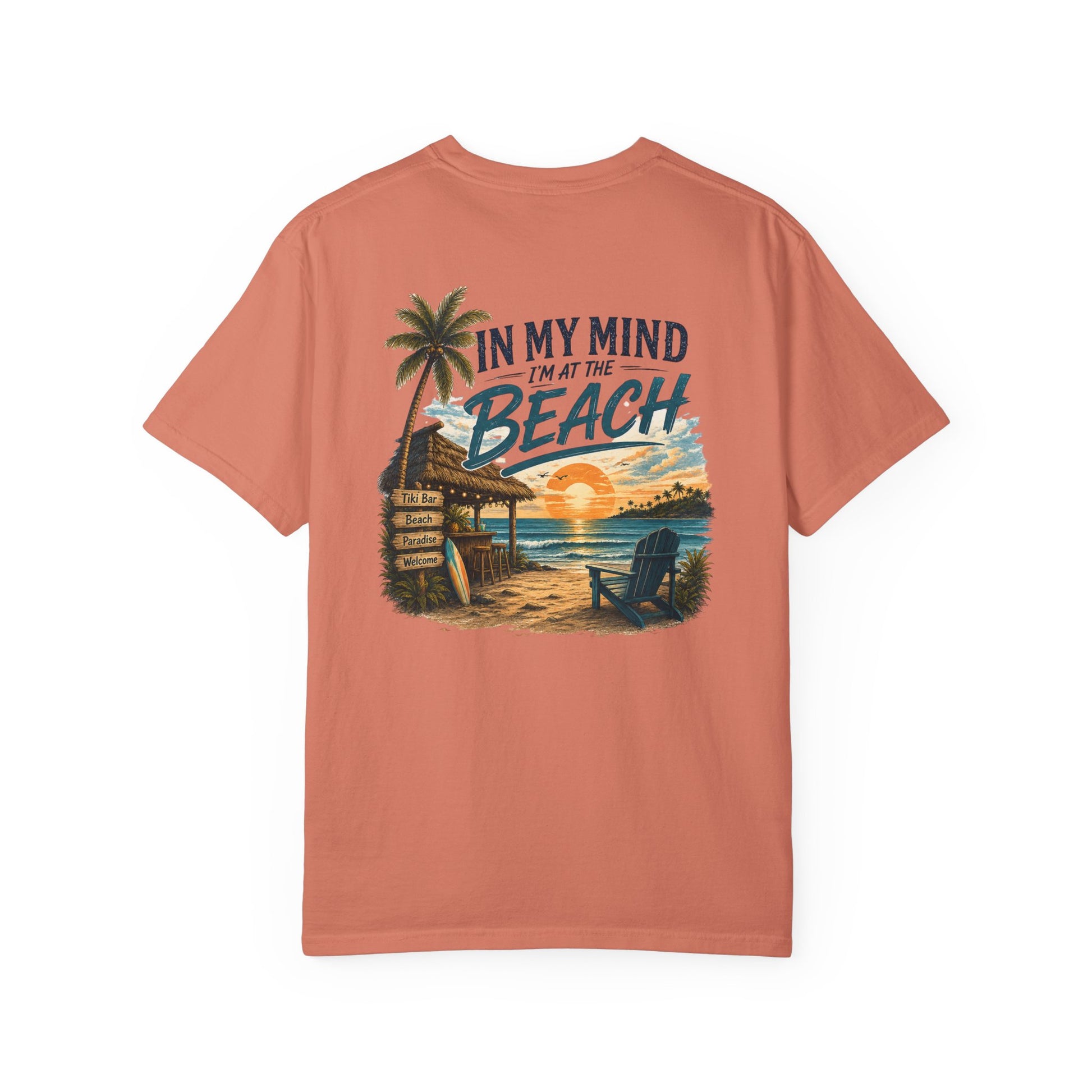 Peach-colored t-shirt with beach graphic and text on a white background