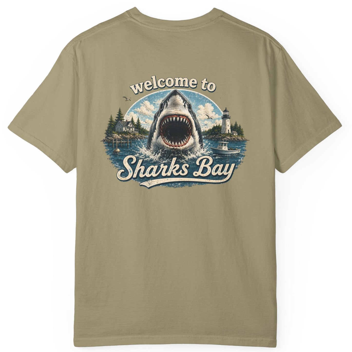 Khaki t-shirt with a shark graphic and 'Welcome to Sharks Bay' text on a white background