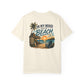 Beige t-shirt with beach graphic and text on a white background