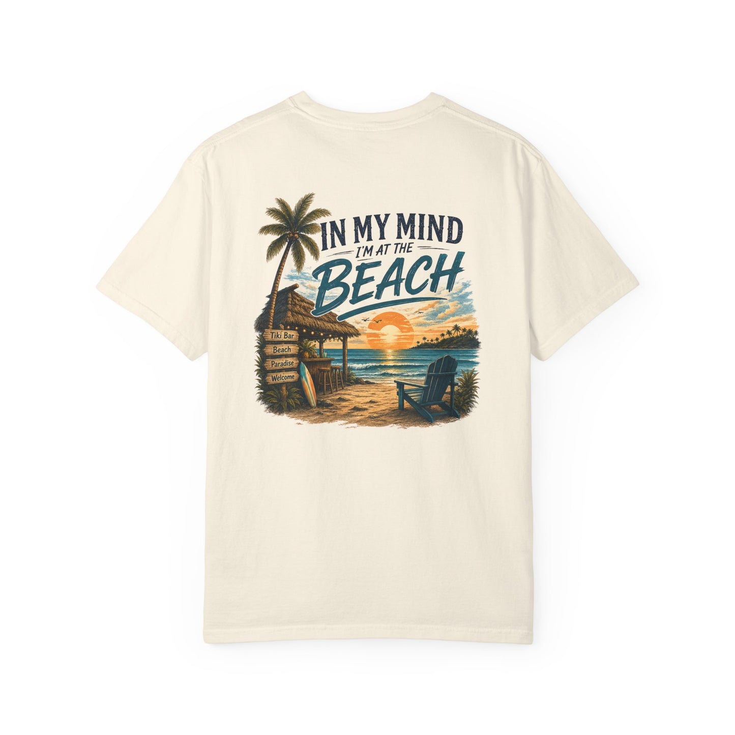 Beige t-shirt with beach graphic and text on a white background