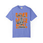 Purple t-shirt with colorful graphic design on a white background at Caribbean Rays