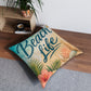 Square tufted floor pillow with 'Beach Life' beach design and seashells in beige and teal.