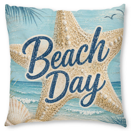 Square beach-themed throw pillow featuring a large starfish, seashells, ocean waves, palm leaves, and the words 'Beach Day' in navy script over a light blue and beige print, shown on a white background.