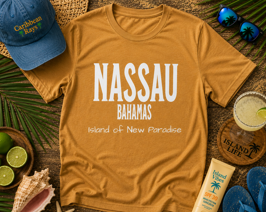 Brown t-shirt with 'Nassau Bahamas' text on a wooden surface with beach-themed items.