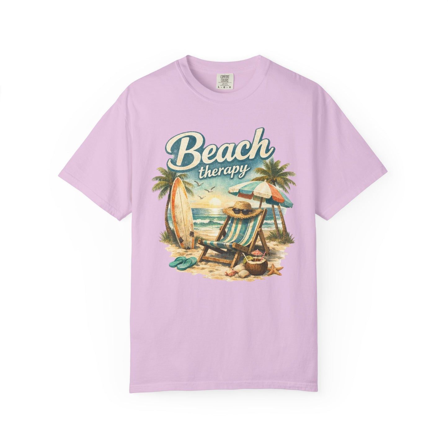 Pink t-shirt with 'Beach Therapy' graphic design featuring a beach scene.