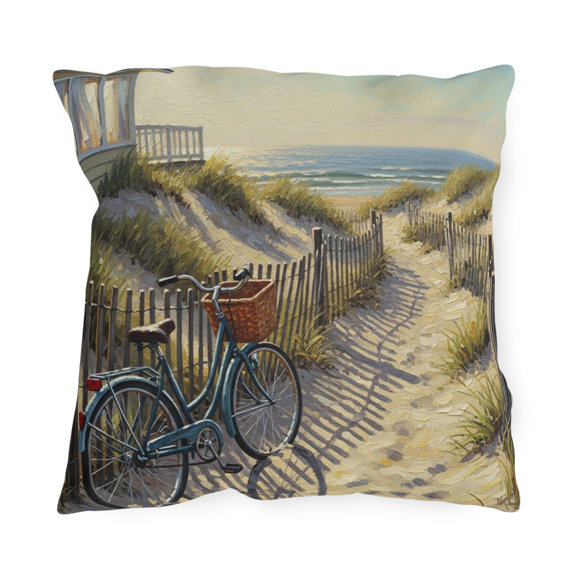 Decorative pillow with a beach scene featuring a bicycle and ocean view.