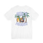 White t-shirt with 'Beach Paradise' graphic featuring palm trees and a beach chair on a white background by Caribbean Rays