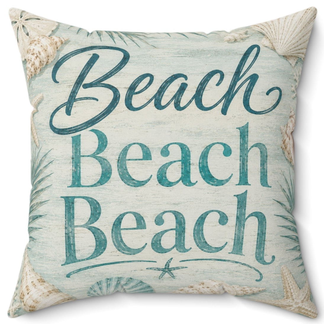A square decorative throw pillow with a beach-themed print featuring the text 'Beach Beach Beach' in teal script and block letters, surrounded by seashell and palm leaf motifs on a light blue and beige background.