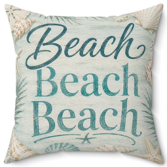 A square decorative throw pillow with a beach-themed print featuring the text 'Beach Beach Beach' in teal script and block letters, surrounded by seashell and palm leaf motifs on a light blue and beige background.