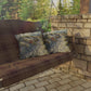 Wooden swing with patterned cushions on a stone patio