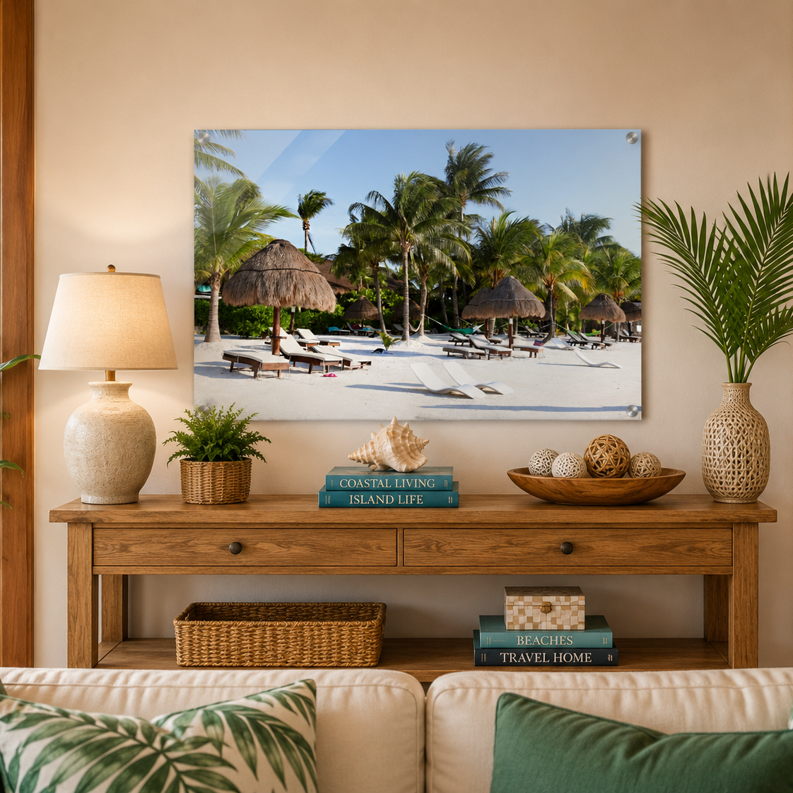 Living room with a wooden console table, lamp, books, and decorative items against a beach scene wall art.