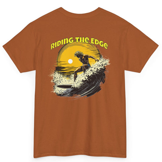 Brown t-shirt with a graphic design of a person riding a wave and 'Riding the Edge' text on a white background.