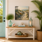 Nautical-themed decor with a bench, lantern, and beach-themed painting in a room with a green door and plants.