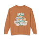 Brown sweatshirt with 'Born to be a Beach Girl' text and beach-themed graphics on a white background at Caribbean Rays