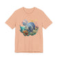 Peach t-shirt with a colorful fish graphic on a white background by Caribbean Rays