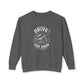 A dark gray crewneck sweatshirt with a white graphic print on the front featuring a golf club head and the text 'DRIVE FOR SHOW'.
