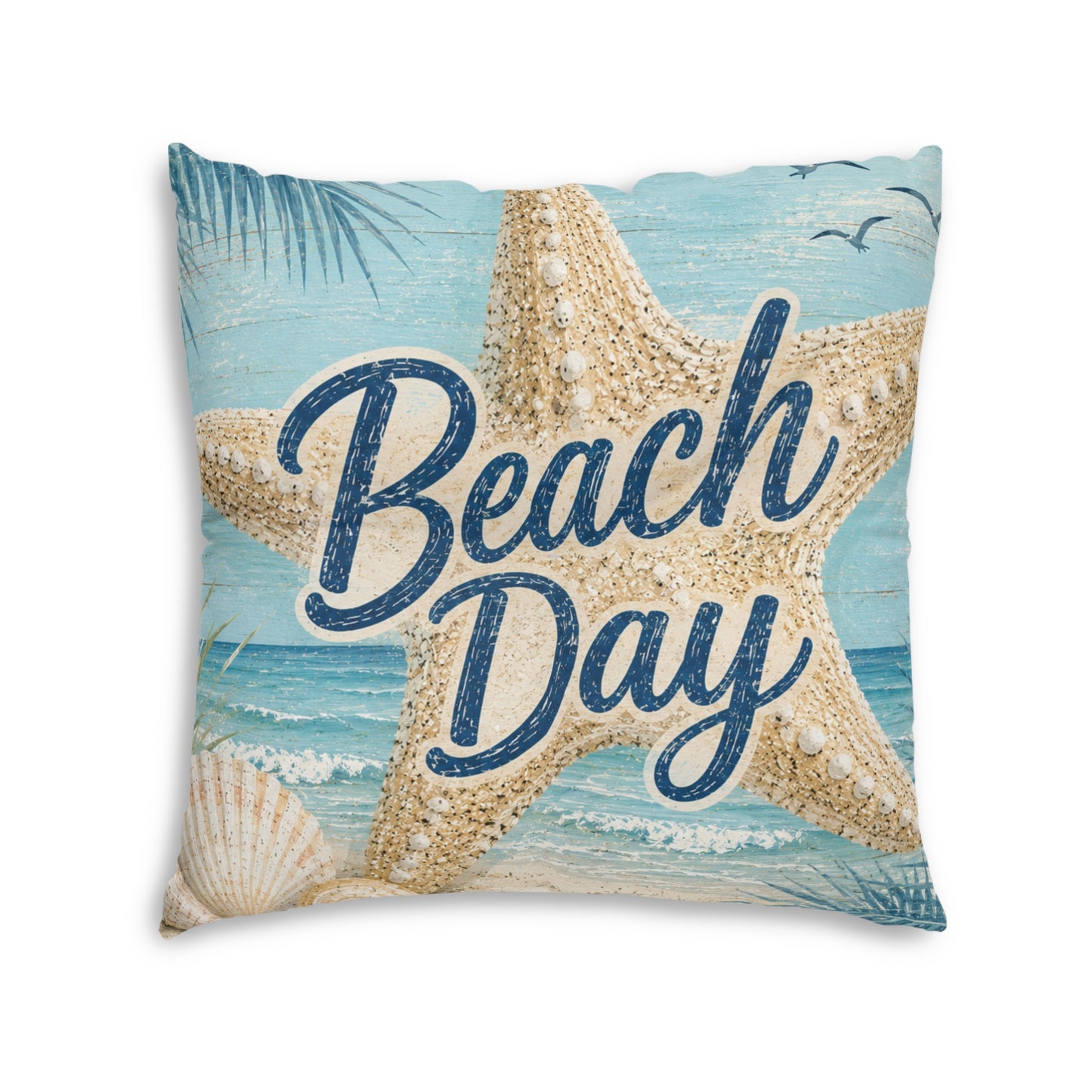 Square tufted floor pillow with 'Beach Day' script, light blue beach and starfish design.