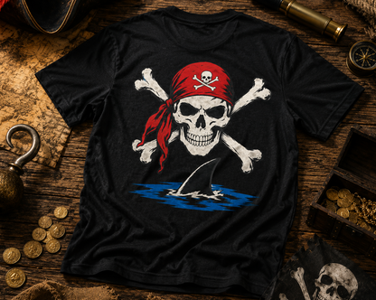 Black t-shirt with a pirate skull design on a wooden surface with pirate-themed items.