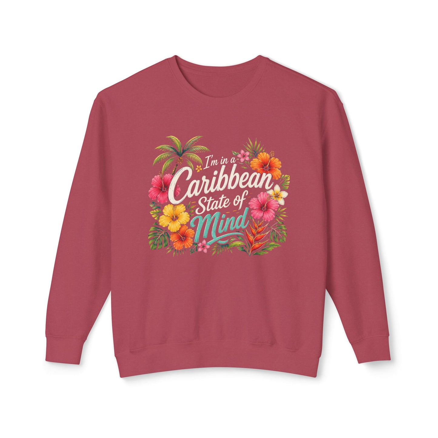 A dusty rose crewneck sweatshirt featuring a colorful graphic on the chest with tropical flowers and the text 'I'm in a Caribbean State of Mind'.