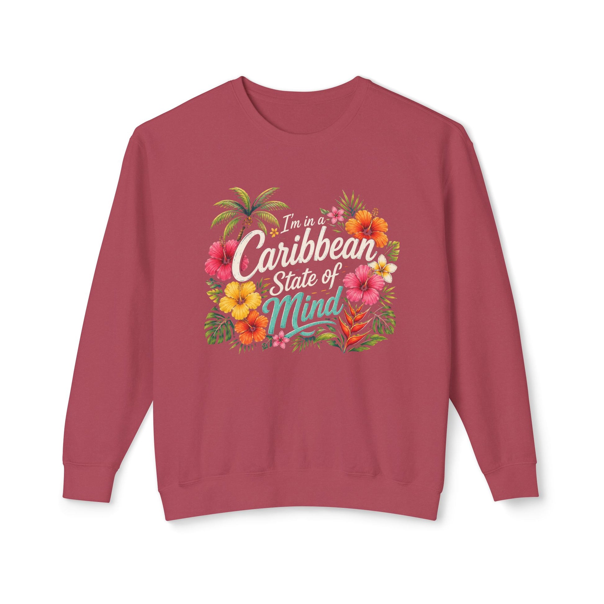 A dusty rose crewneck sweatshirt featuring a colorful graphic on the chest with tropical flowers and the text 'I'm in a Caribbean State of Mind'.
